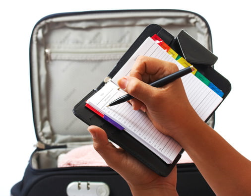 Writing Out A Packing List Ready For A Vacation
