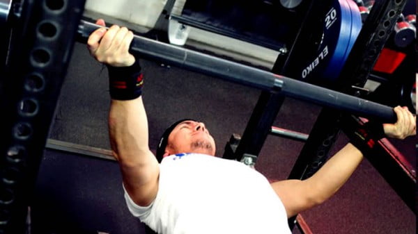 The bench press on a settle with a reverse tilt